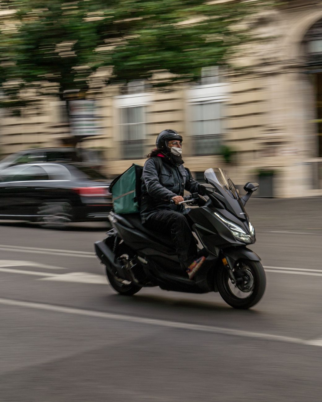 Self-employed Deliveroo scooter rider working in London